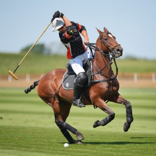 Pierandrea Müller receives the Challenge Cup from Jonathan Russell at Cowdray Park 2026
